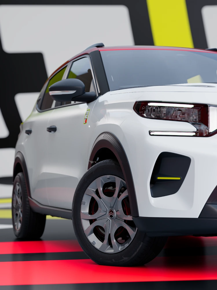 Vista detalle tres cuartos delantero del Citroën ë-C3 TONIC edición limitada, coche eléctrico urbano con diseño de rueda y protección de carrocería, alternativa electrica inteligente