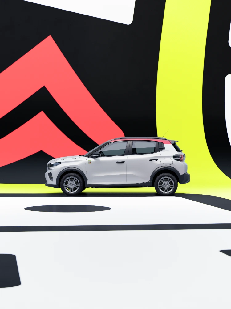 Vista perfil lateral del Citroën ë-C3 TONIC edición limitada, coche eléctrico urbano en ambiente de estudio, diseño compacto, alternativa electrica inteligente