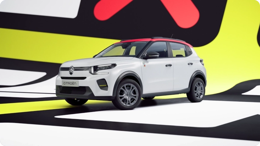 Front three-quarter view Citroën ë-C3 TONIC limited edition electric city car bold colors and urban design, smart EV alternative