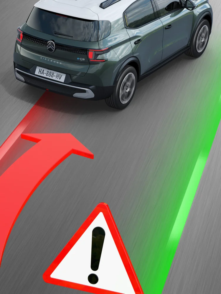 Vista trasera en carretera del Citroën ë-C3 Aircross SUV destacando alerta de cambio de carril para una movilidad más segura, controlada y asequible.