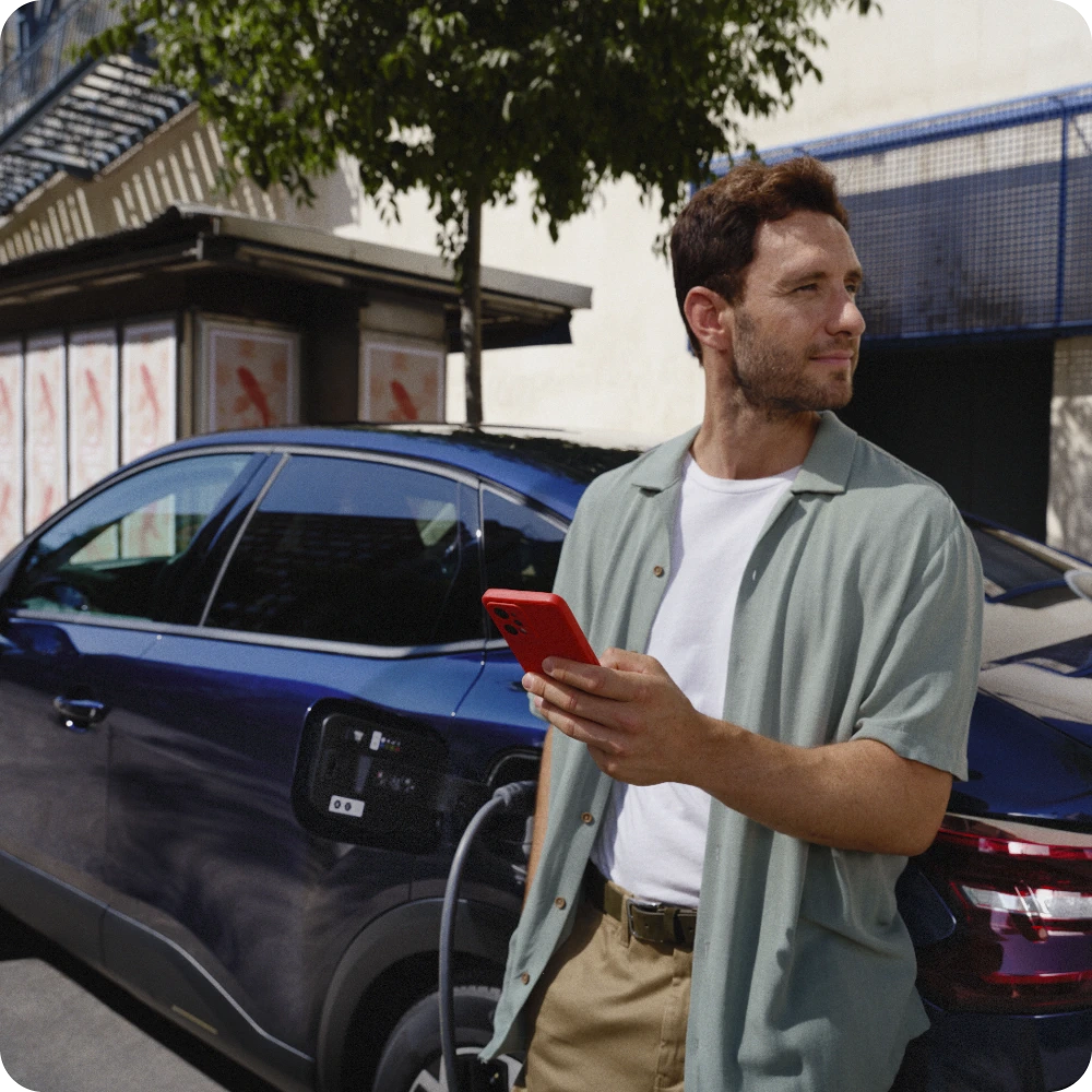Side view ë‑C4 charging while using trip‑planning services illustrating easy long‑distance electric travel